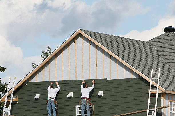 Professional Storm Damage Siding Repair technician working in Bridgeville, PA